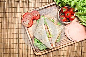 Top view of sandwiches and ham with tomatoes,Club sandwich with cheese and vegetable photo