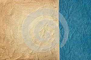 Top view sandy beach and towel. Background with copy space