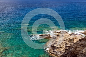 top view of sea water and rocky coast