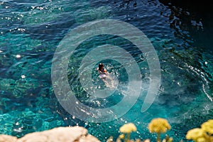 Top view of the sea water spray after jumping into the sea from a cliff. Seascape. Travel concept. Seascape on the background of t