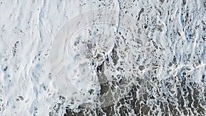 Top view on sea waves. Sea waves and foam from a cruise ship. Stock. Texture of beautiful wave in the ocean. sea water