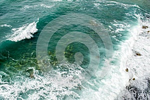 Top view on sea waves. Large waves run to shore