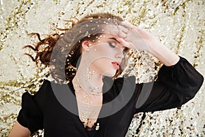 Top view of seductive charming young woman with closed eyes