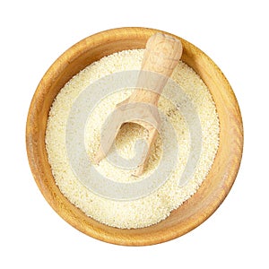 Top view of semolina in wooden bowl isolated on white background