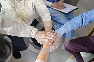 Top view of Seniors people holding  hands together in elder health  care center  , concept of old people health care , group