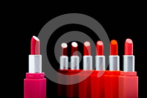 Top view Set colorful pastel Lipstick arranged in a circle on white background with copy space. cute beauty cosmetic nude make up