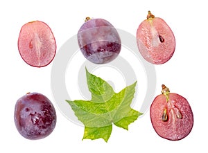 Top view set of red or violet grapes with halves and green leaf isolated on white background with clipping path