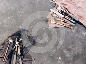 Top view of set silverware on vintage stone background