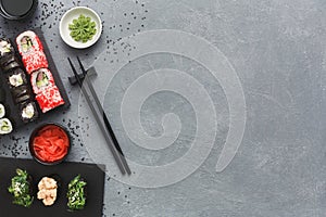 Top view set of sushi maki and rolls on grey table