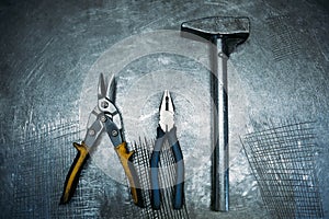 Top view of set working tools lying on metal table