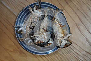 top view Several fried mackerel Stacked on a ceramic plate. Place on the table background, fish, food, object, health, copy space