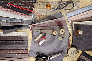 Top view of sewing table with fabrics and supplies for home decor or quilting project