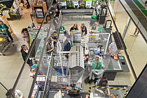 top view of shoppers at the grocery store checkout