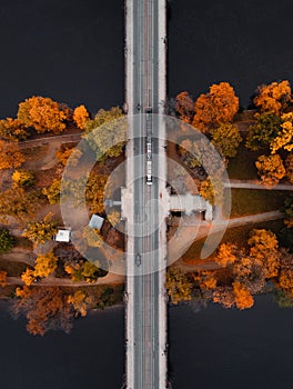 Top view shot of bridge (road) over the colorful Strelecky Island with beautiful yellow trees in Prague Czechia photo