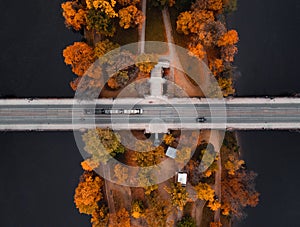 Top view shot of bridge (road) over the colorful Strelecky Island with beautiful yellow trees photo