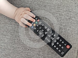 Top view shot of a cute little kid playing with remote control