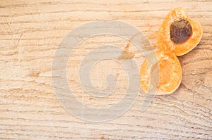 Top view shot of a delicious apricot on a wooden tabl