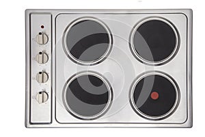 Top view shot of metallic electric cooktop with control handles