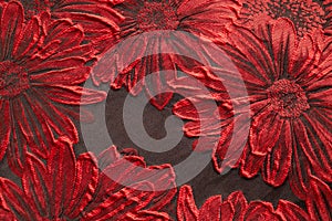 Top view shot of red flower fabric texture with black color background.  Textile and garment wallpaper concept