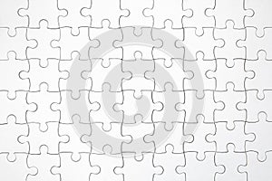 Top view shot of white jigsaw puzzel background