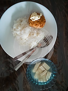 Top view simple Japanese healthy dish. Rice with tofu soup with Chicken Katsu and mayoinnaise