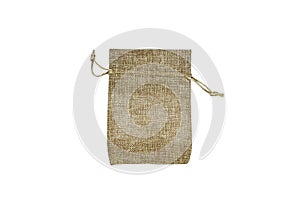 Top view of single empty fabric cotton small bag (beige burlap pouch) isolated on white background. Copy space for text.