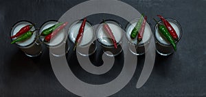 Top view on a six white coconut drinks decorated with red and gr