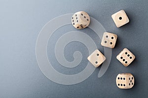 Top view of six wooden dice on table. Board game. Gambling devices.