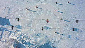 Top view of ski lift for transportation skiers on snowy slope.