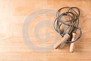 Top view of Skipping rope on wooden table background.