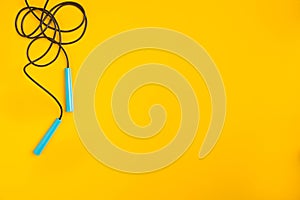 Top view of Skipping rope on yellow background