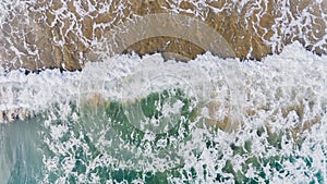 Top view from sky of sea wave and sand beach landscape