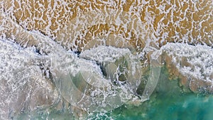 Top view from sky of sea wave and sand beach landscape