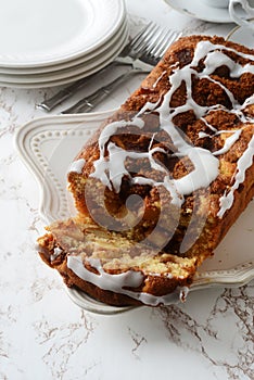 Sliced apple fritter loaf bread cake with plates