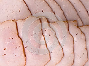 Top view of sliced smoked beef meat background. Raw beef ham isolated over white