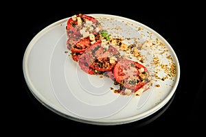 top view on sliced tomato modern decorated with assorted herbs