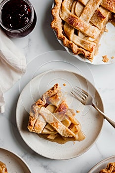 Top view of slices of delicious apple pie served on white table