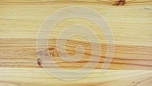 top view slowly zooms in at empty rustic style light yellow wooden surface