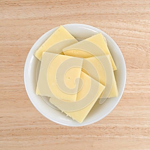 Sharp cheddar cheese in a small bowl