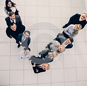 top view. smiling business team looking at the camera.