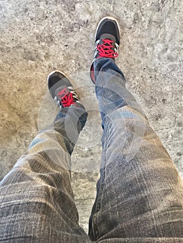 Top view of sneakers shoes standing on cement floor backgrounds