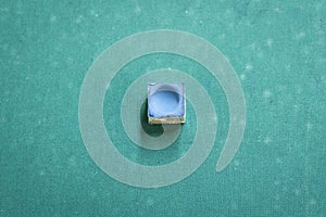 Top view of a snooker chalk on a pool table