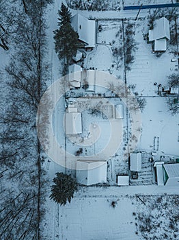 Top view of snowcovered houses in a cottage and country village