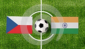 Top view soccer ball with Czech Republic vs. India flags match on green football field