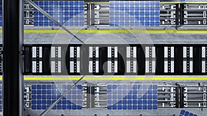 Top view of solar panel assembly line operated by high tech robot arms