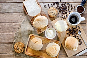 Top view of some freshly bakery with hot fresh coffee espresso  on wooden board for breakfast concept
