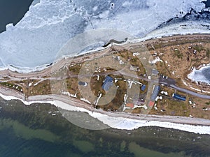 Top view at Sorve Peninsula with buildings and lighthouse. Baltic sea at spring season. Saaremaa, Estonia, Europe