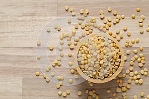 Top view of split soybeans in a bowl on wooder background, Healthy eating concept