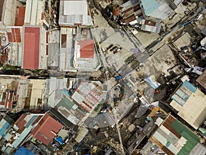 Top view of a squalid squatter area with narrow passageways and corrugated metal roofs in Metro Manila