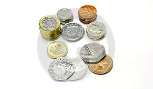 Top view stack of British currency coins isolate on white background